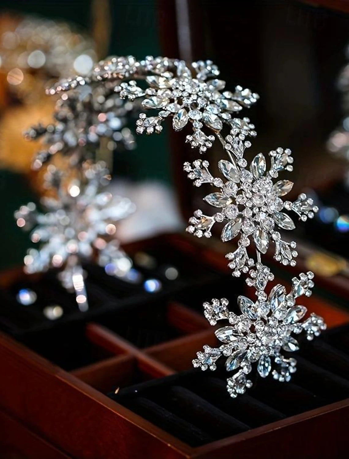 Side view of the snowflake headband, showcasing its delicate design and sparkle.