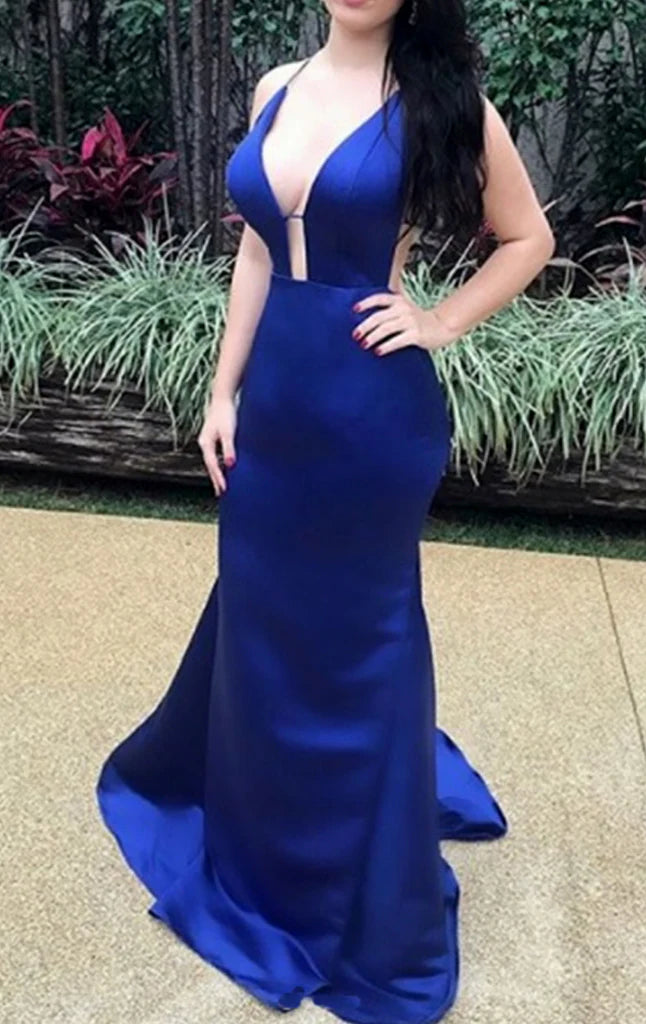 Model wearing a deep V-neck satin maxi prom dress with spaghetti straps.