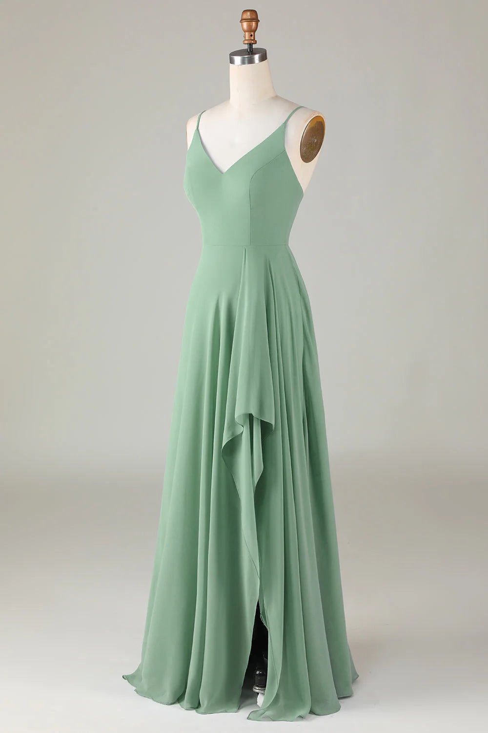 Side profile of a woman showcasing a flowing long bridesmaid gown.