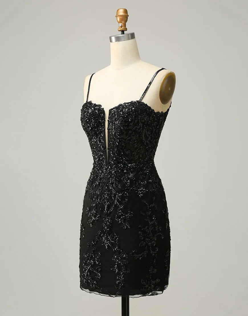 Back view of a black sequin mini dress showing the corset lacing.