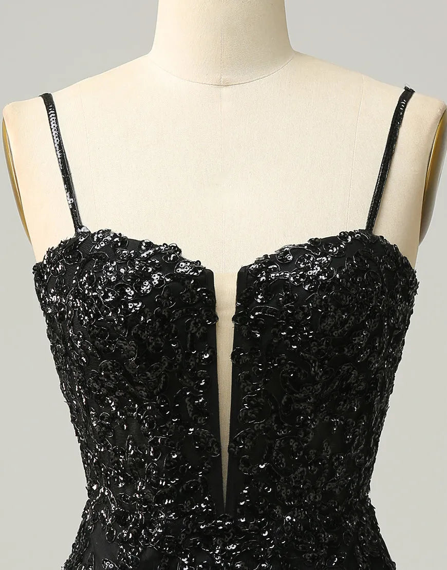 Close-up of the sequin fabric on a black mini dress.