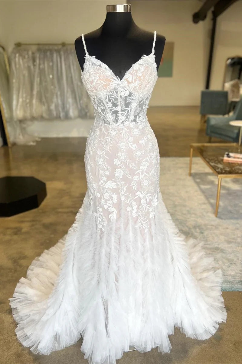 Elegant trumpet wedding dress with spaghetti straps.