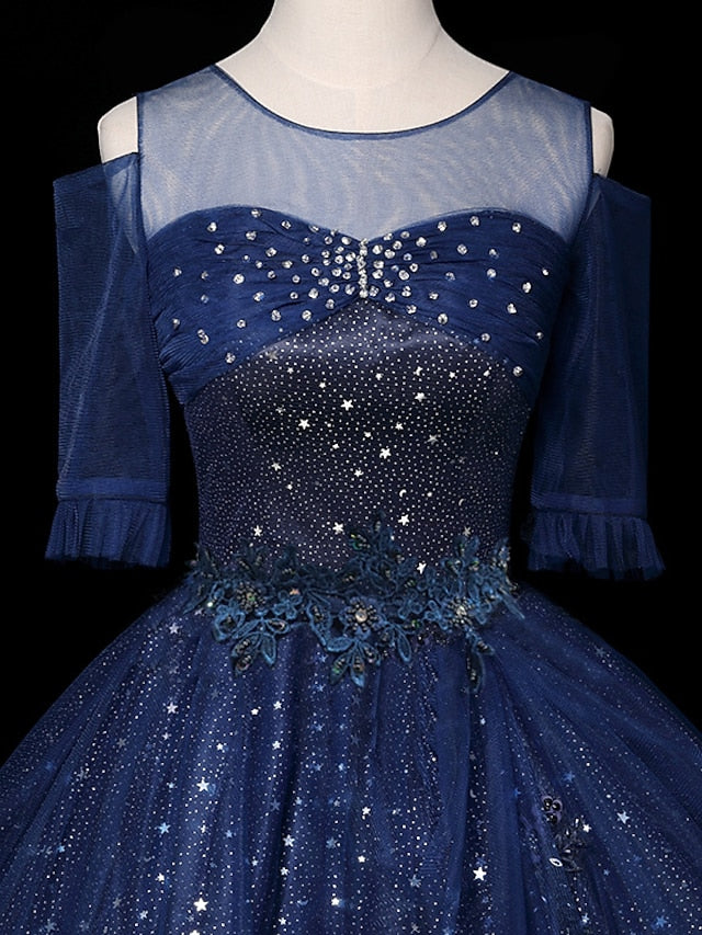 Side profile of a sparkling prom ball gown with half sleeves.