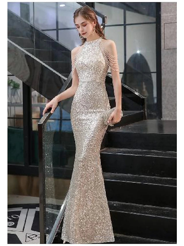 Model wearing a sparkle halter neck mermaid dress.