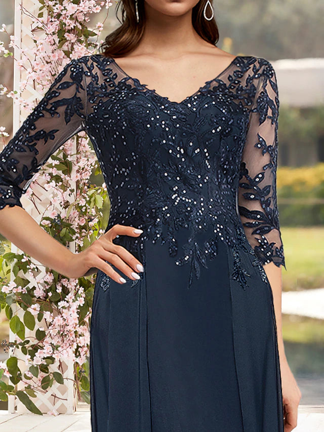 Close-up of sequin appliques and lace on the 3/4 sleeve.