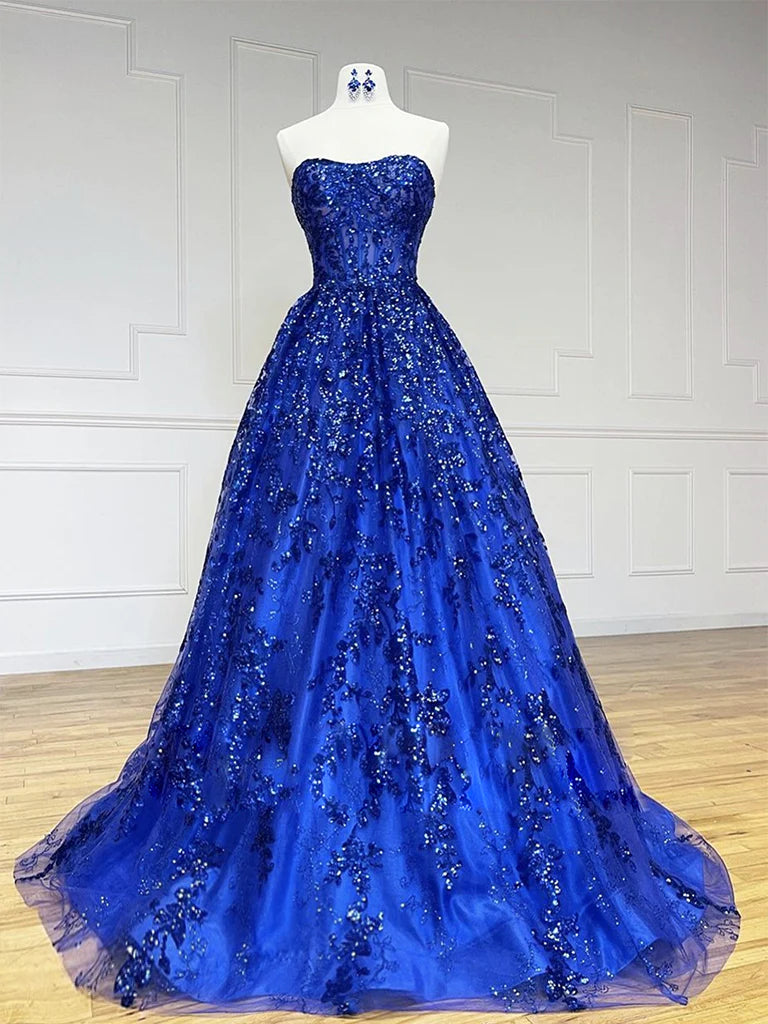 Woman wearing an elegant A-line V-neck tulle sequin long prom dress.
