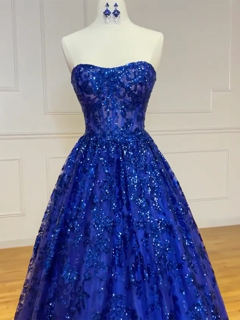 Model showcasing a sparkling A-line formal gown with sequin and tulle details.
