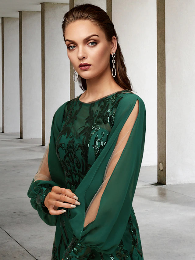 Side view of a sparkling long sleeve mermaid gown with sequin appliques.