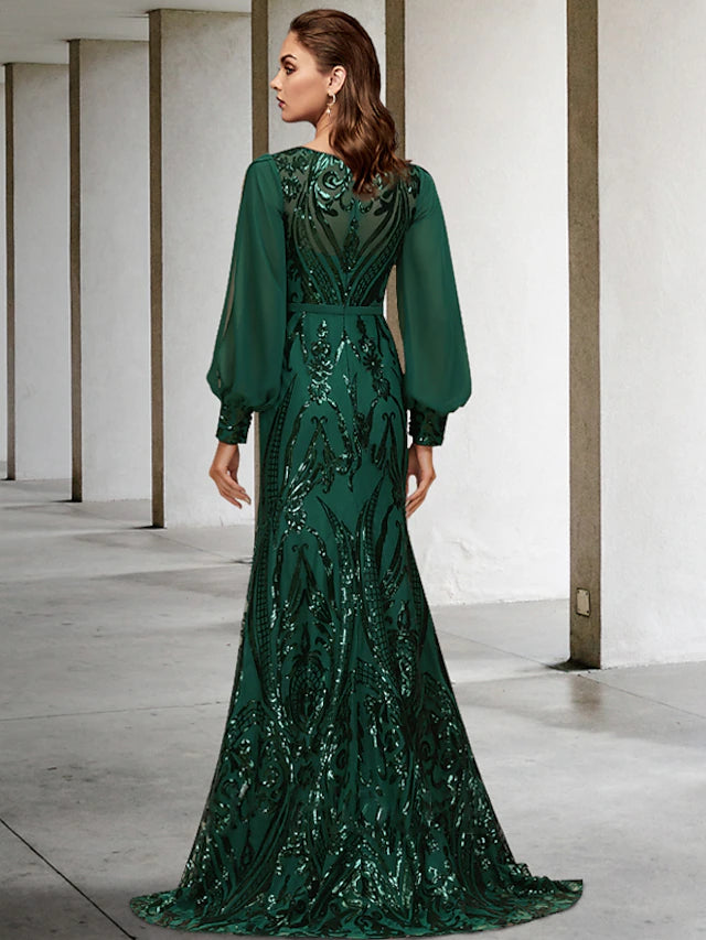 Close-up of sequin appliques on a long sleeve wedding guest dress.