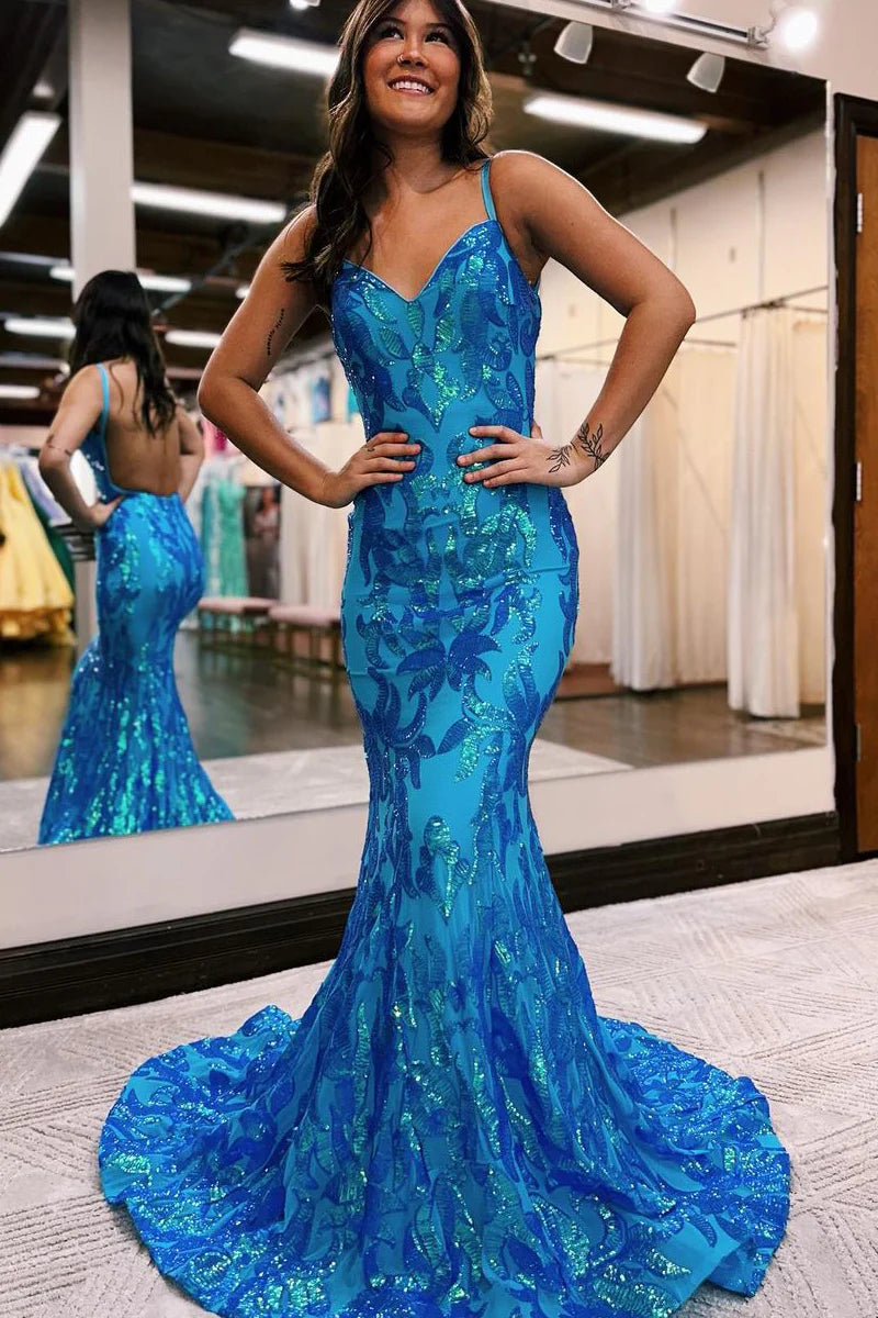 Elegant mermaid prom dress with shimmering sequins and delicate spaghetti straps.