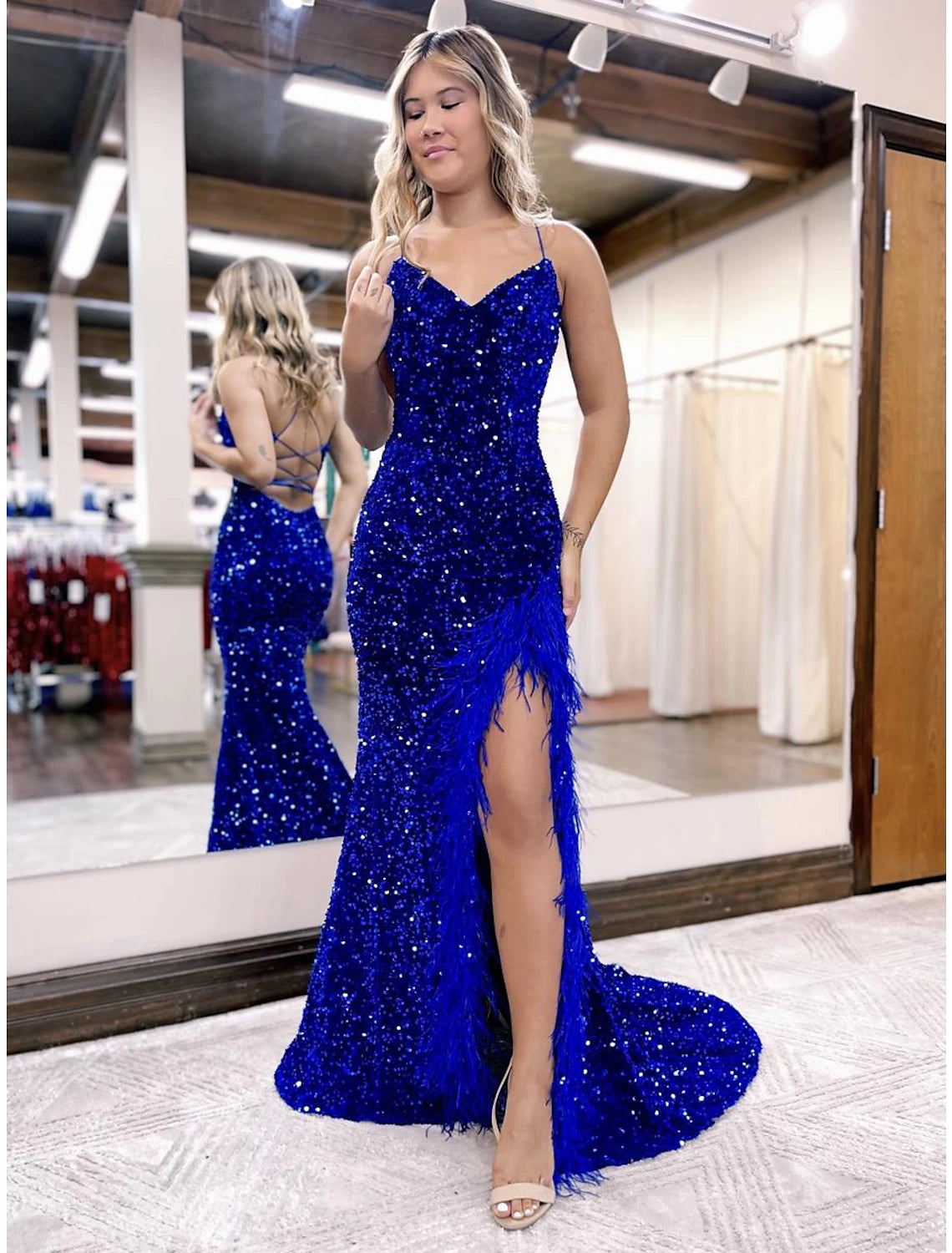 Backless sequined mermaid prom dress with court train.