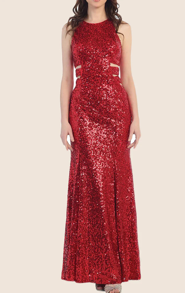 Woman wearing an elegant long sequin prom dress with a sweetheart neckline.