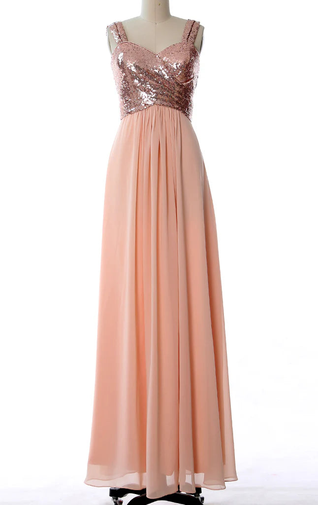 Woman wearing an elegant long sequin and chiffon bridesmaid dress with spaghetti straps.