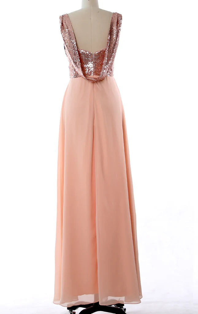 Back view of a woman in a long chiffon bridesmaid dress with sequin bodice.