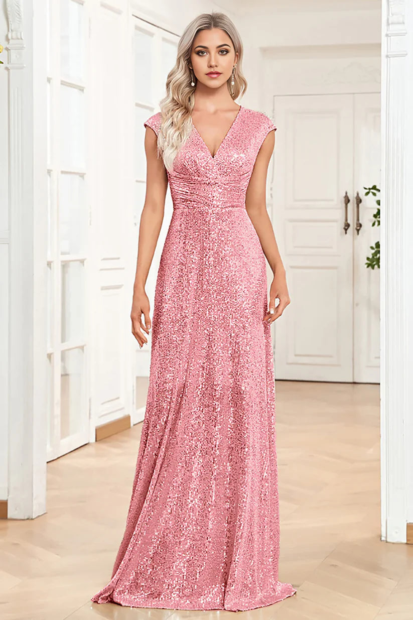 Model walking in a sparkly A-line V-neck Mother of the Bride dress.