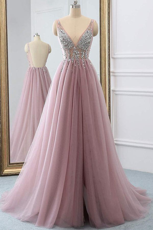 Model wearing a sparkly A-line V-neck tulle long prom dress.