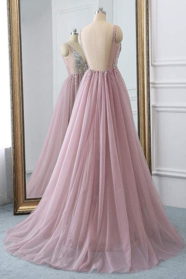 Back view of a model in a sparkly A-line V-neck tulle long prom dress.