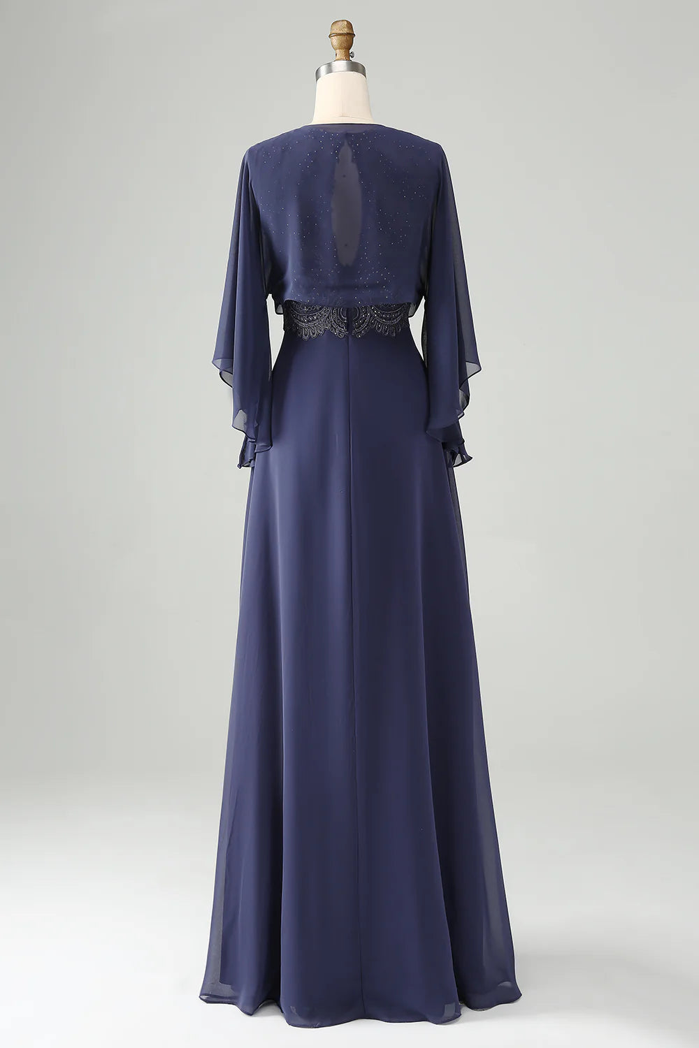 Elegant A-line V-neck gown with intricate beading and a matching shawl.