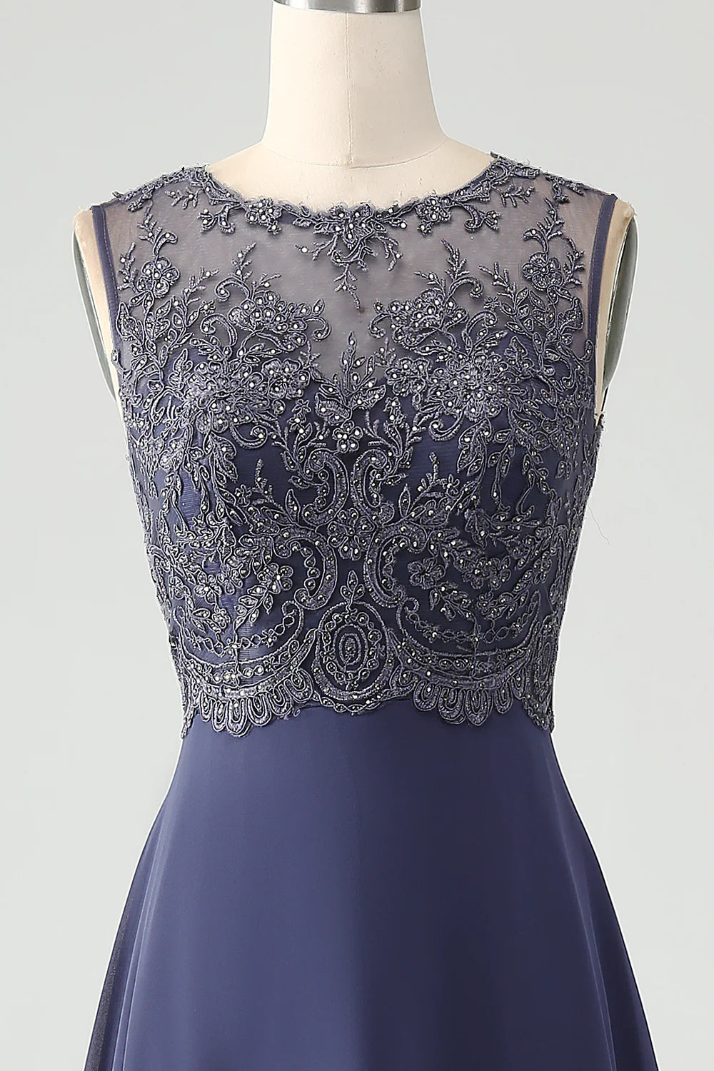 Full length view of the woman in the sparkly A-line V-neck dress.