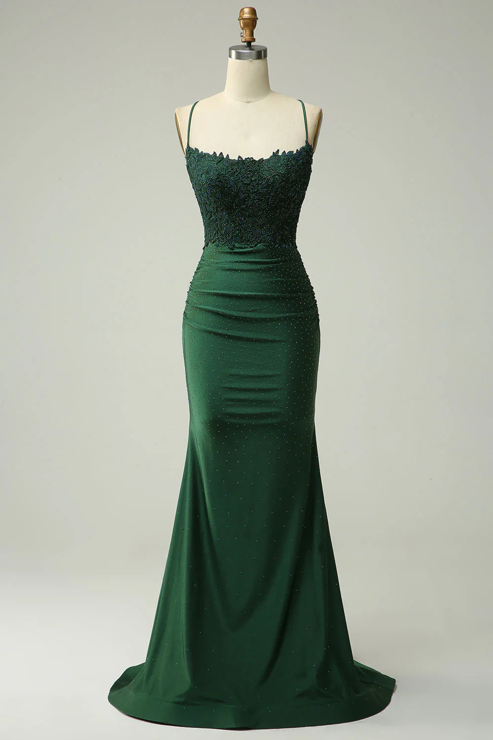 Side view of the sparkly beaded long applique prom dress, highlighting its silhouette.