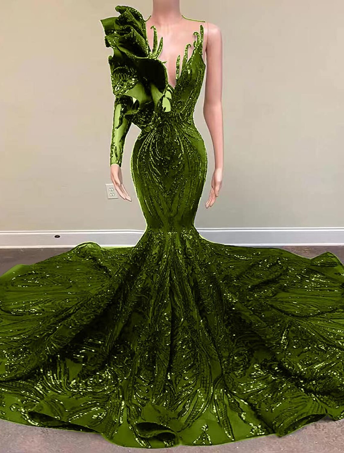 Detail of the one-shoulder neckline and long sleeve on the sequined gown.