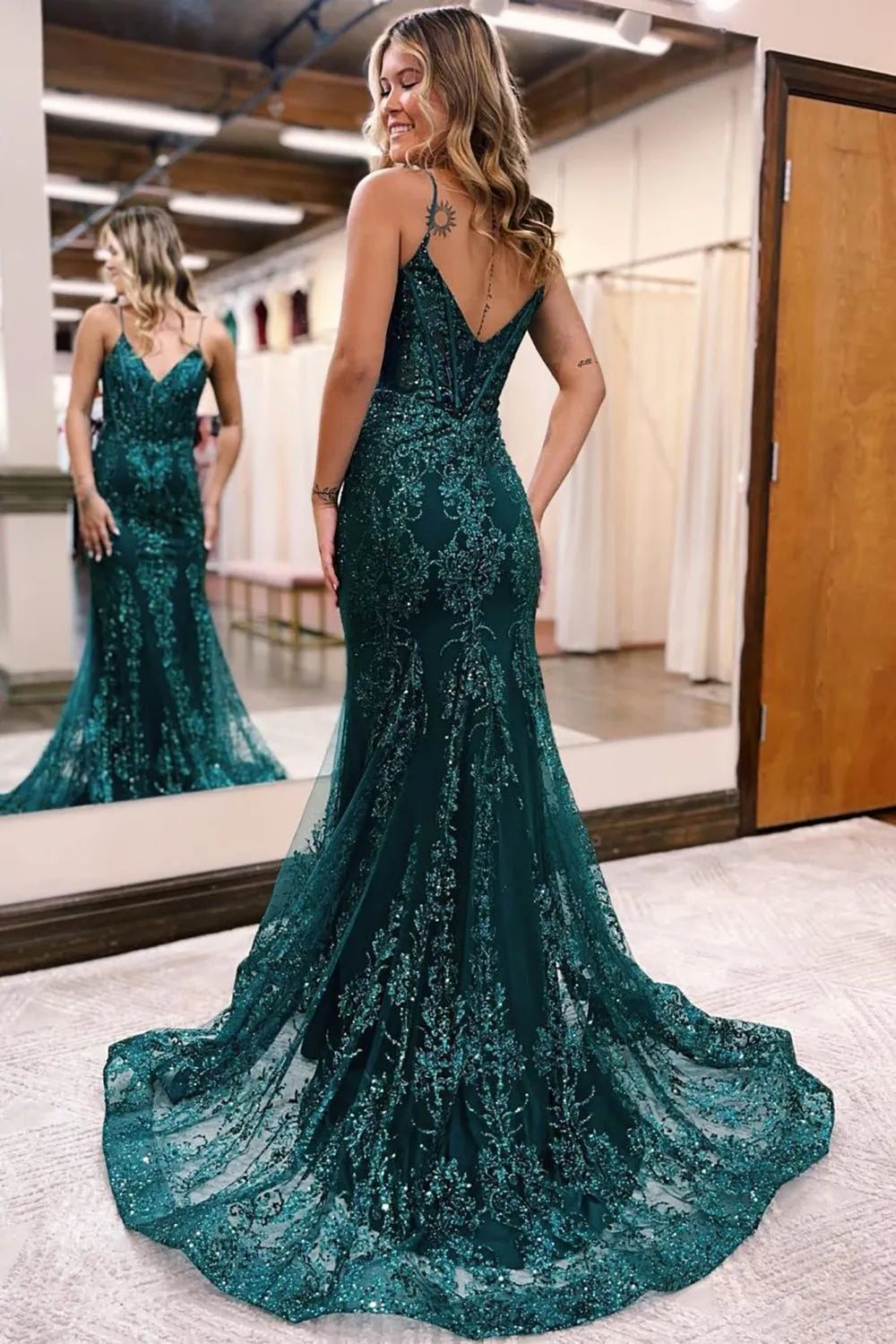 Close-up of sparkly sequin fabric and V-neckline on a mermaid prom dress.