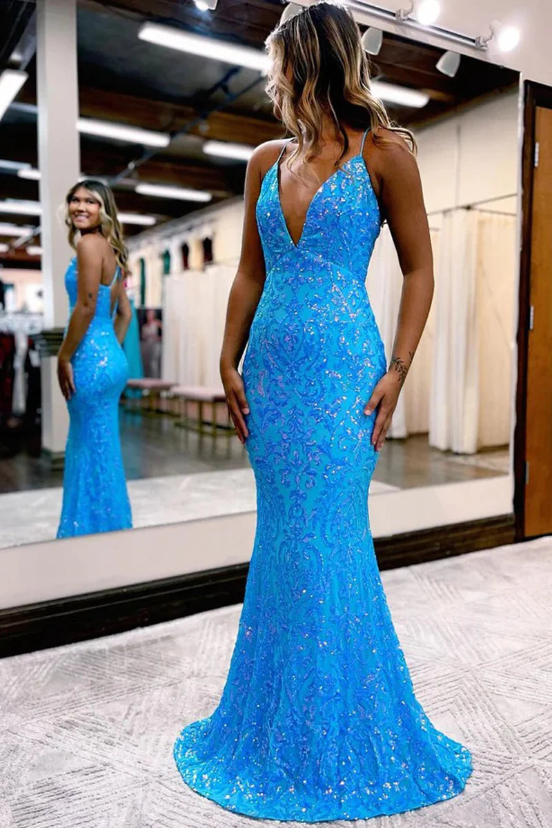 Woman wearing a sparkly mermaid V-neck sequin prom dress.