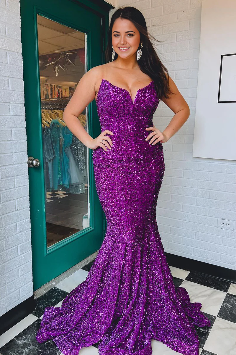 Woman wearing a sparkly purple sequin mermaid strapless long prom dress.