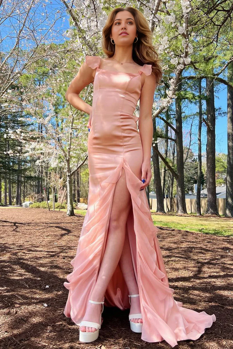 Pink chiffon prom dress with square neck, ruffle, and slit.