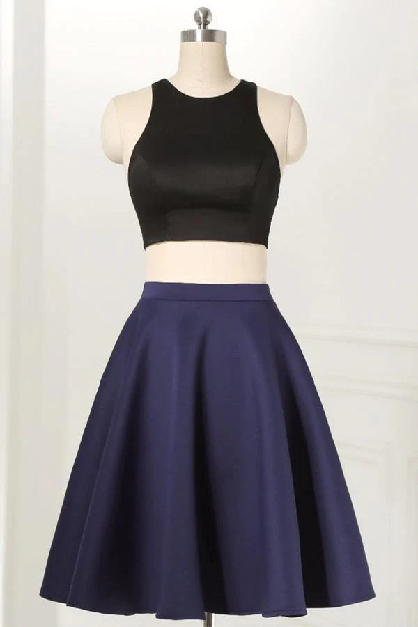 Elegant black two-piece sleeveless knee-length homecoming dress.