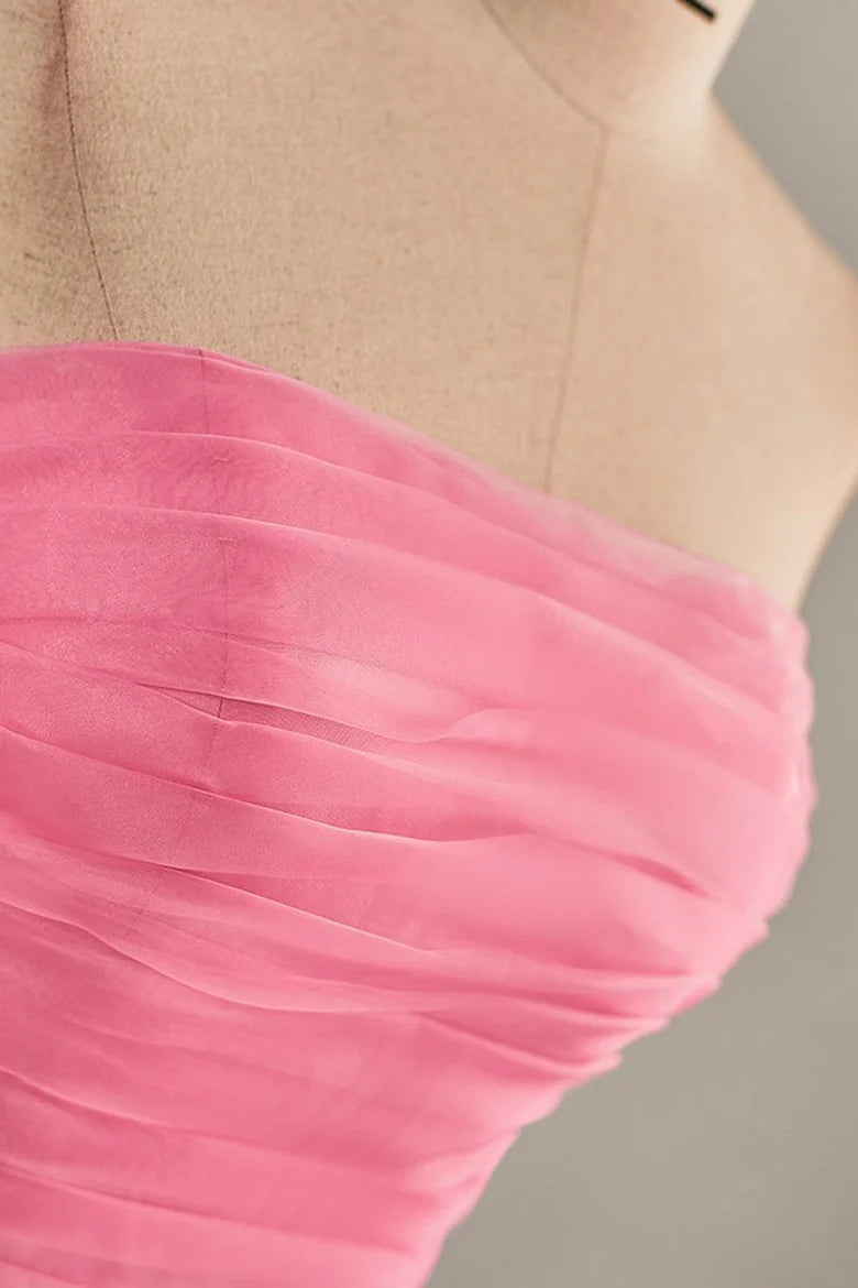 Back view of a hot pink strapless A-line dress.