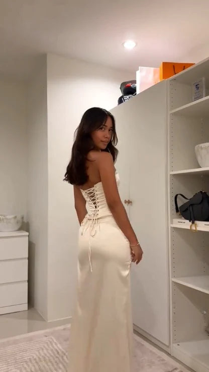Close-up of the bodice and flowing skirt of the formal party dress.