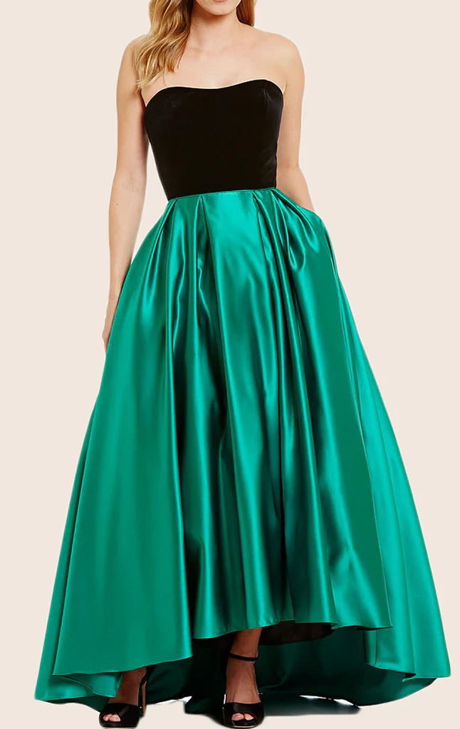 Woman wearing an elegant strapless satin formal gown.