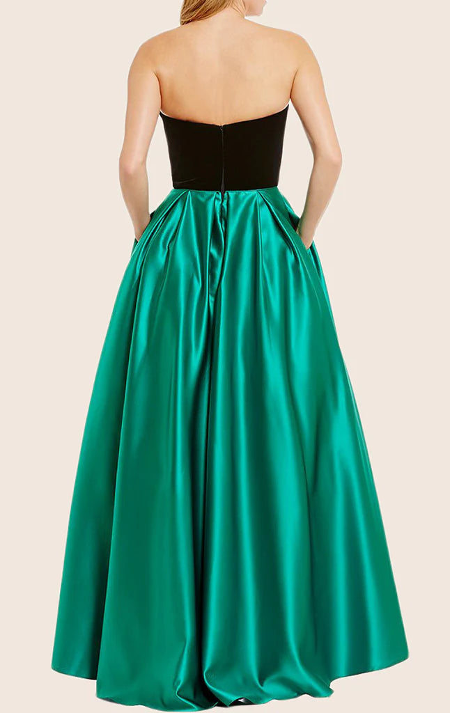 Side view of a woman in a strapless satin evening dress.