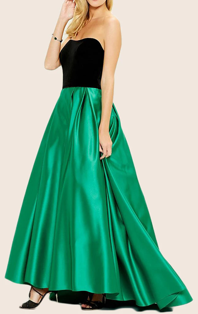 Back view of a woman in a strapless satin prom gown.