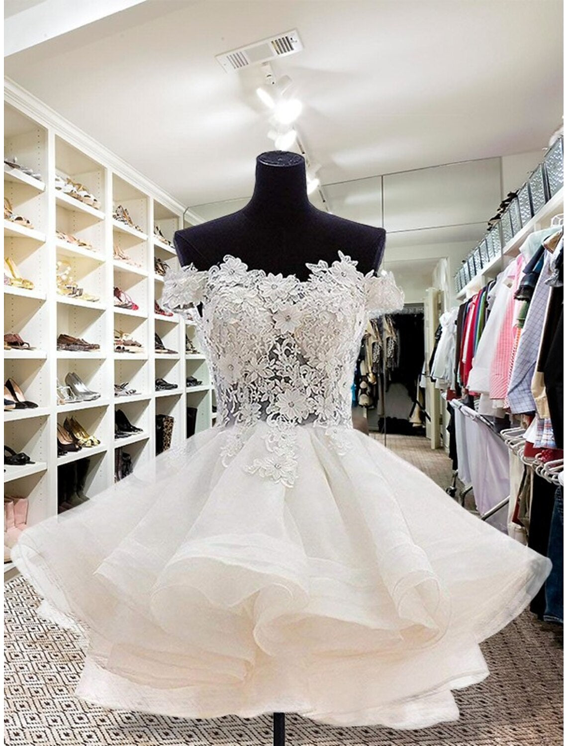 Elegant strapless ball gown homecoming dress with floral appliques and buttons.