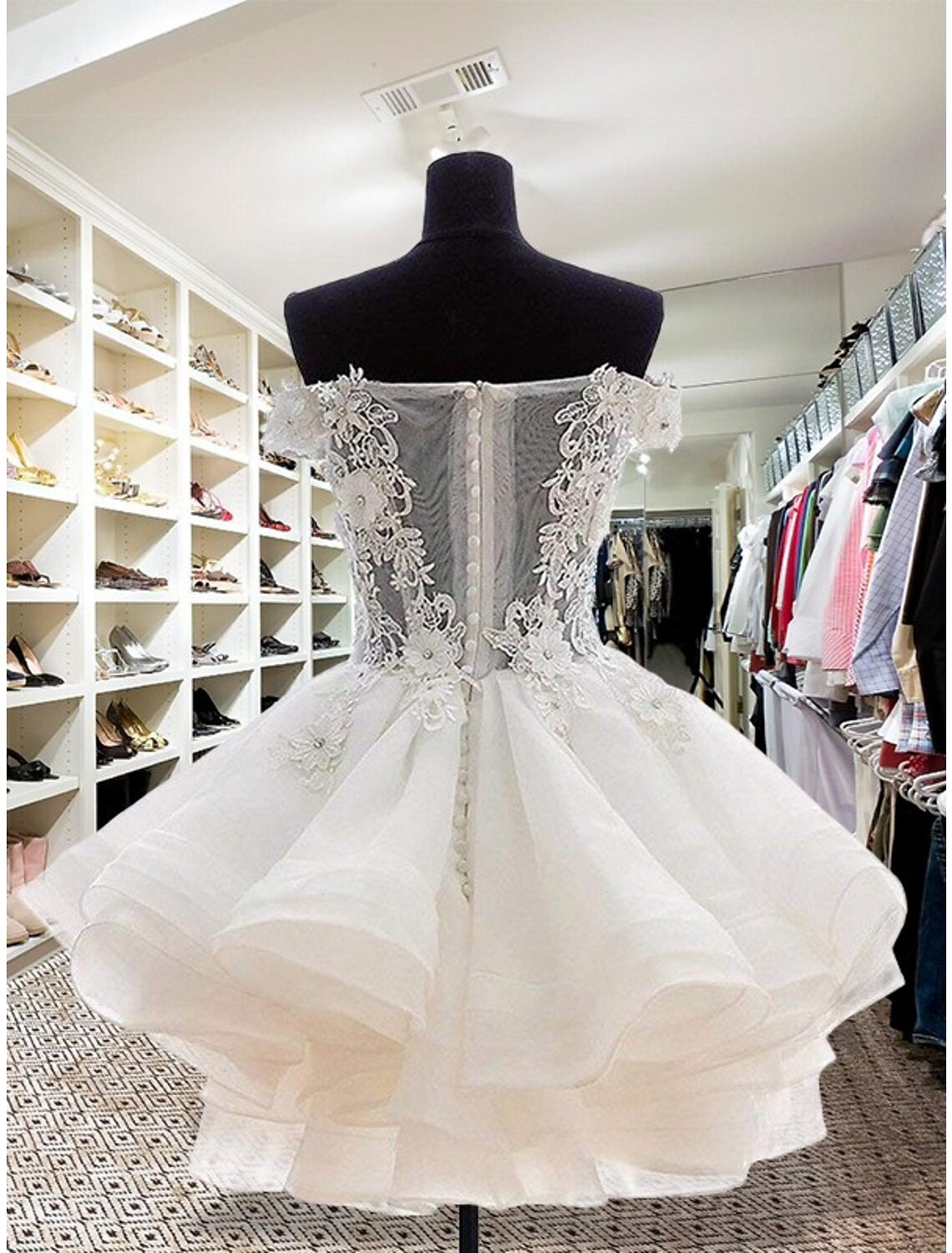 Side view of a festive floral short homecoming dress.