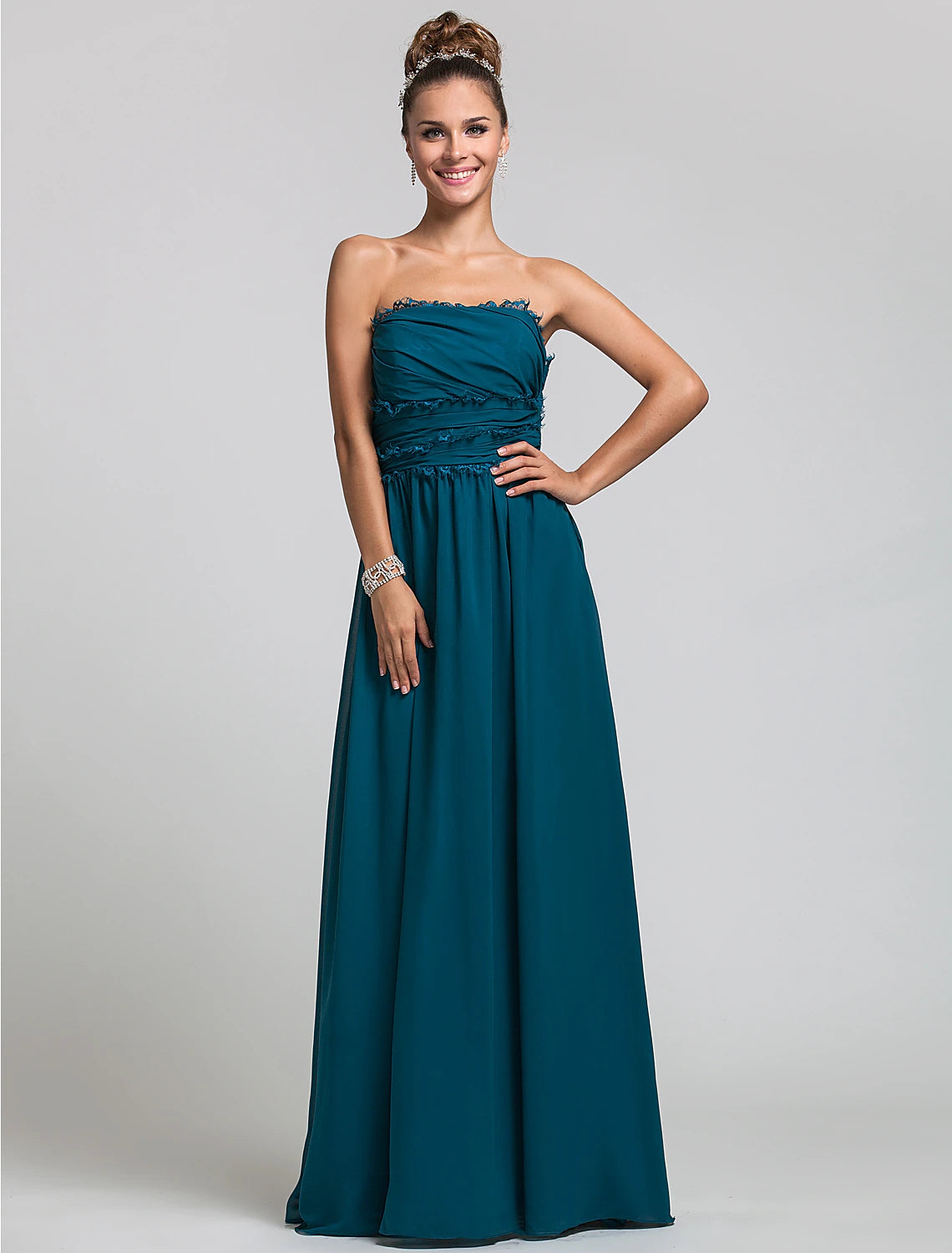 Elegant strapless chiffon bridesmaid dress with side draping and ruffles.