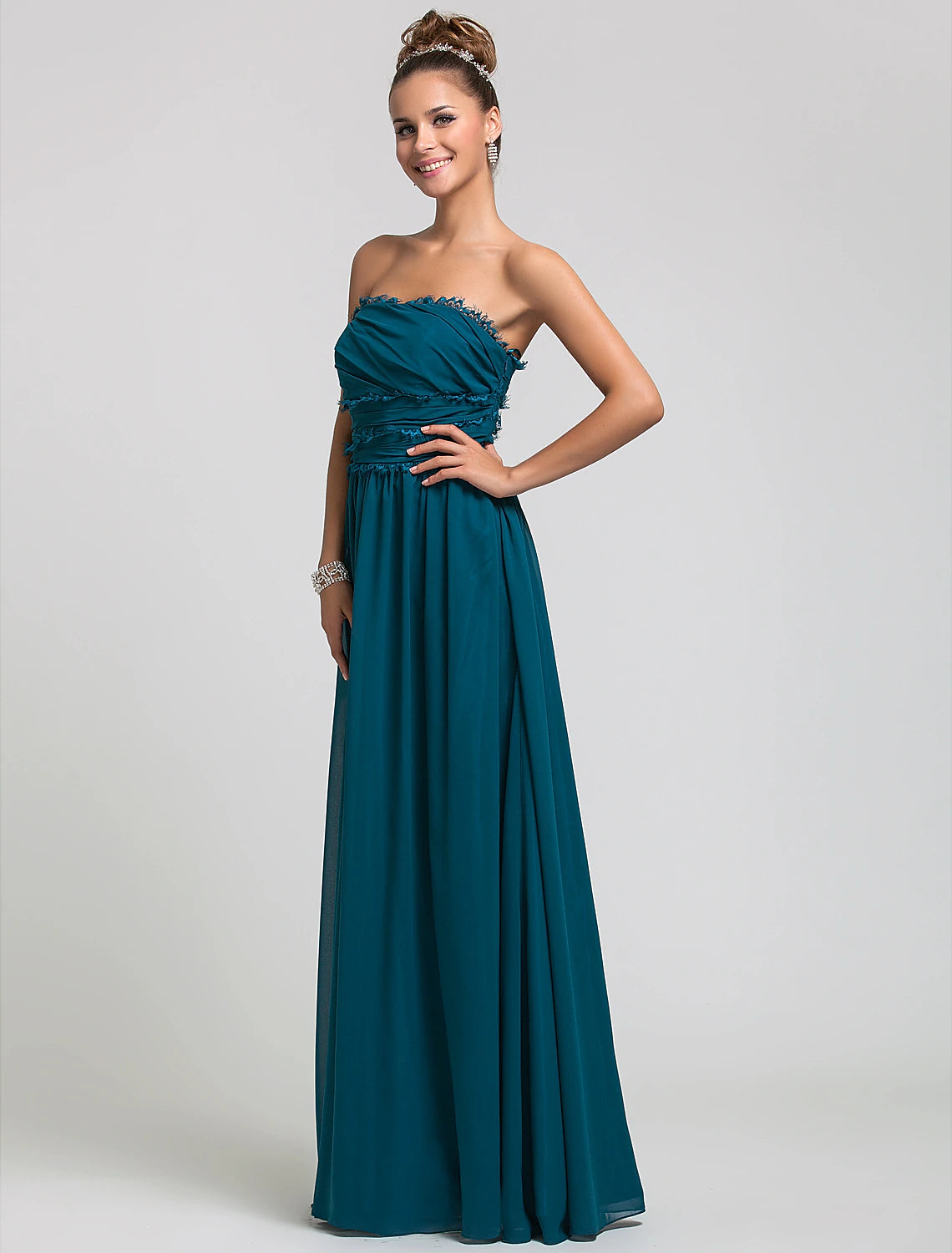 Back view of a floor-length strapless chiffon dress.