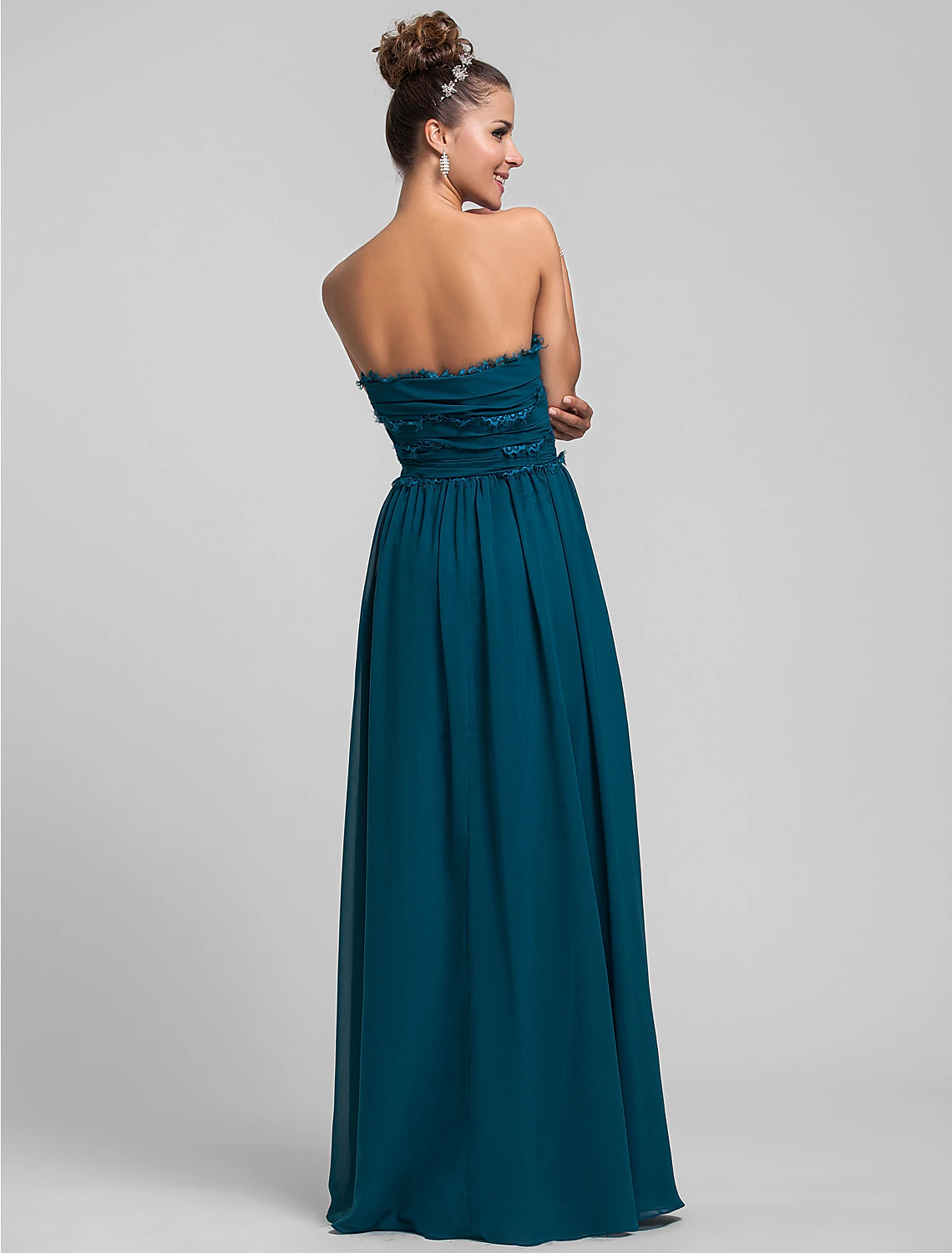Close-up of the side draping and ruffles on a chiffon dress.