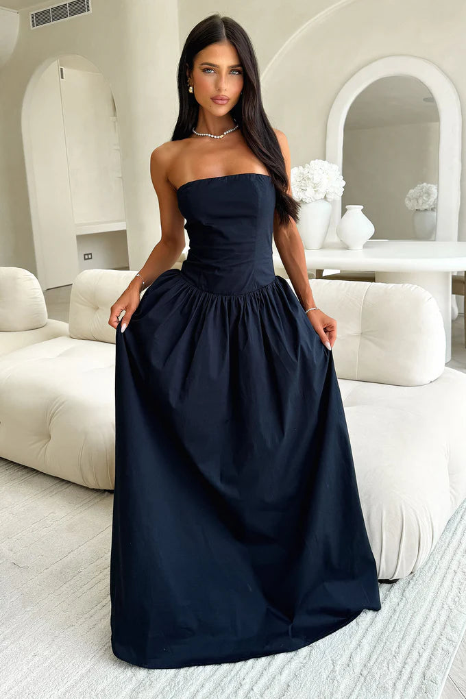 Close-up of the corset bodice on a navy blue strapless dress.