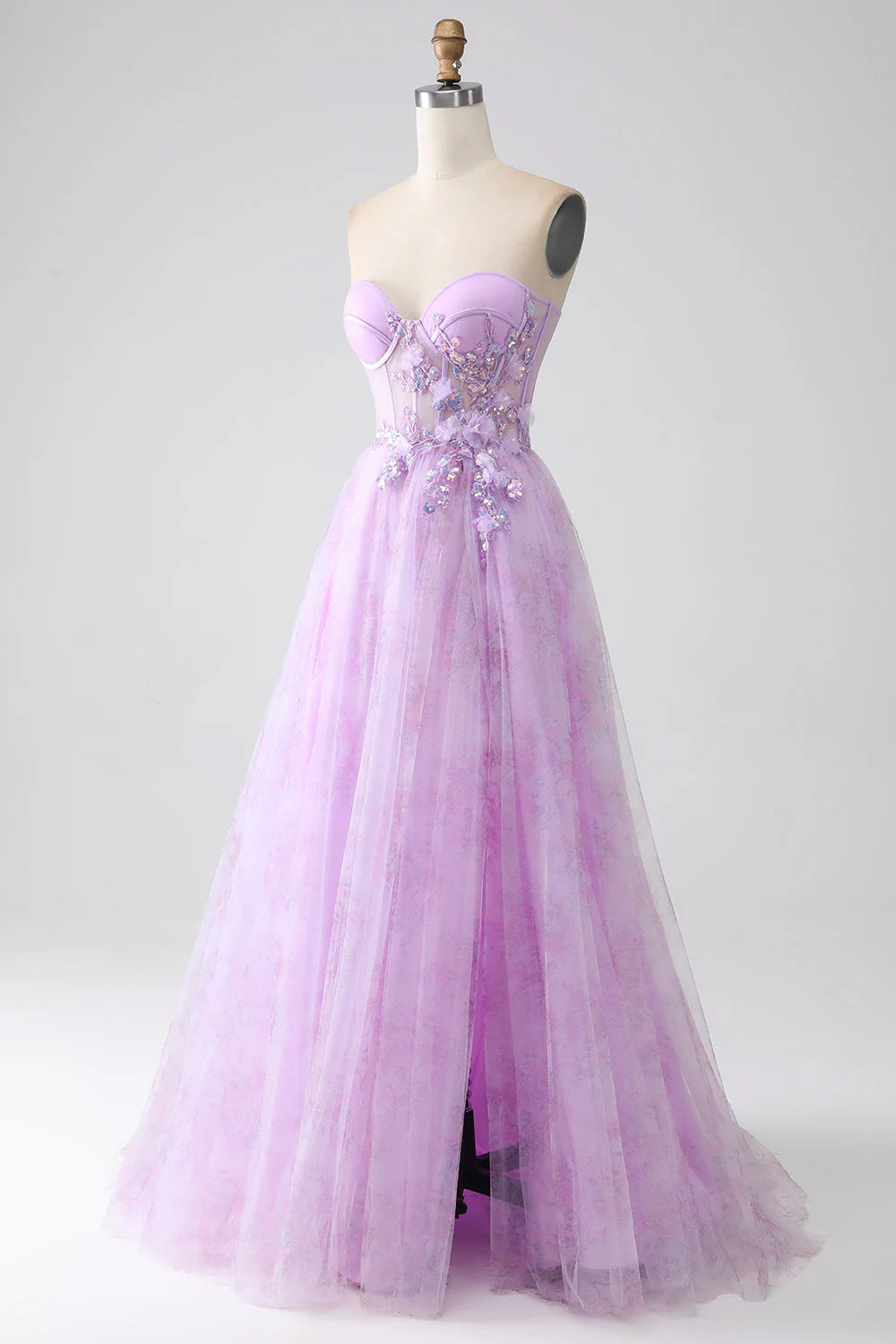 Close-up of the intricate beading detail on a purple strapless corset dress.