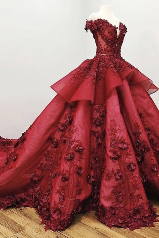 Elegant ball gown quinceanera dress with floral appliques and beading.