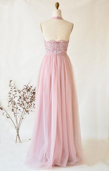 Close-up of the strapless illusion high neck bodice with lace embellishments.