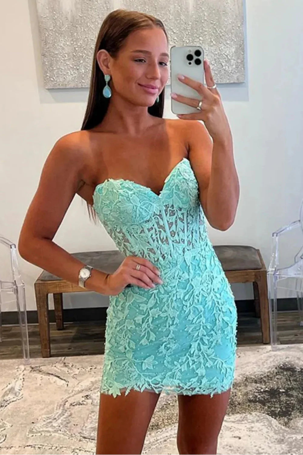 Turquoise strapless bodycon homecoming dress with lace applique and corset back.
