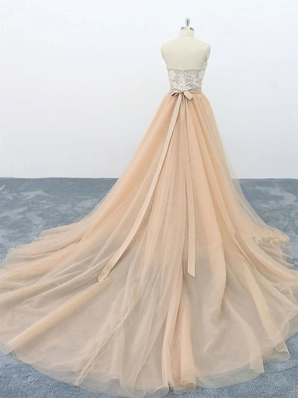 Back view of the strapless lace maxi prom gown, showing the train.