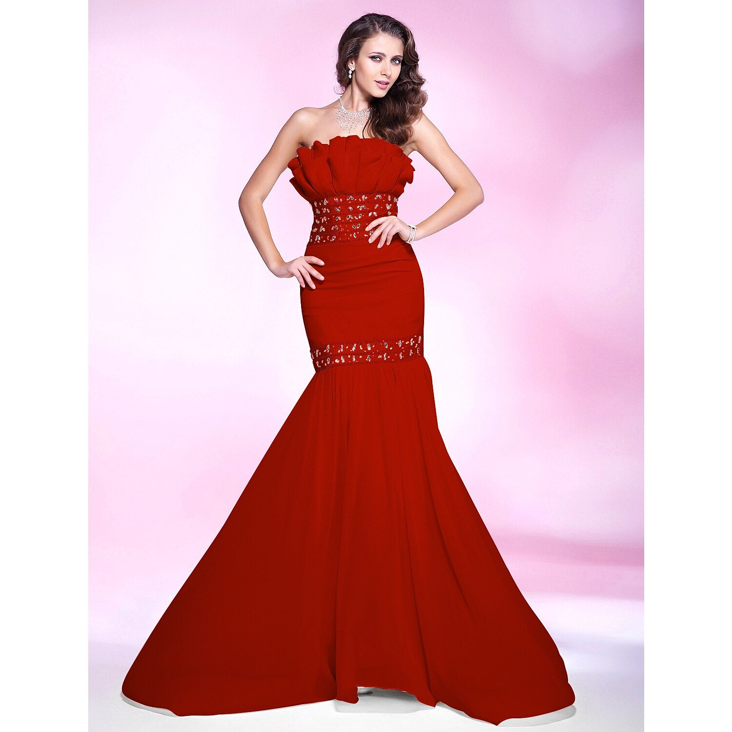 Side view of a formal mermaid gown with delicate beading.