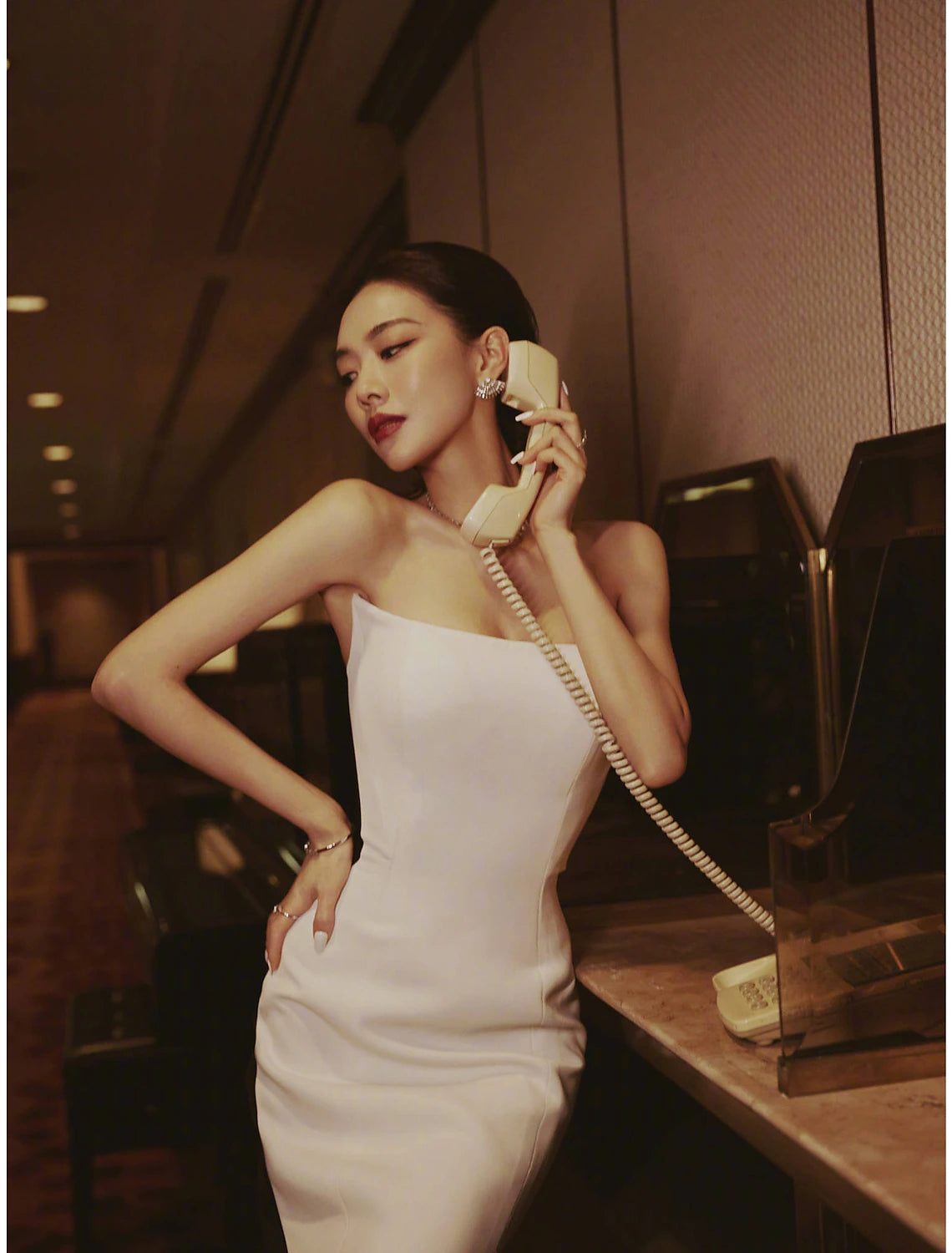 Back view of a strapless mermaid evening gown with court train.