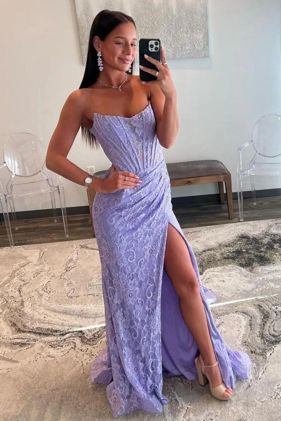 Elegant strapless mermaid prom dress with lace details and a high slit.