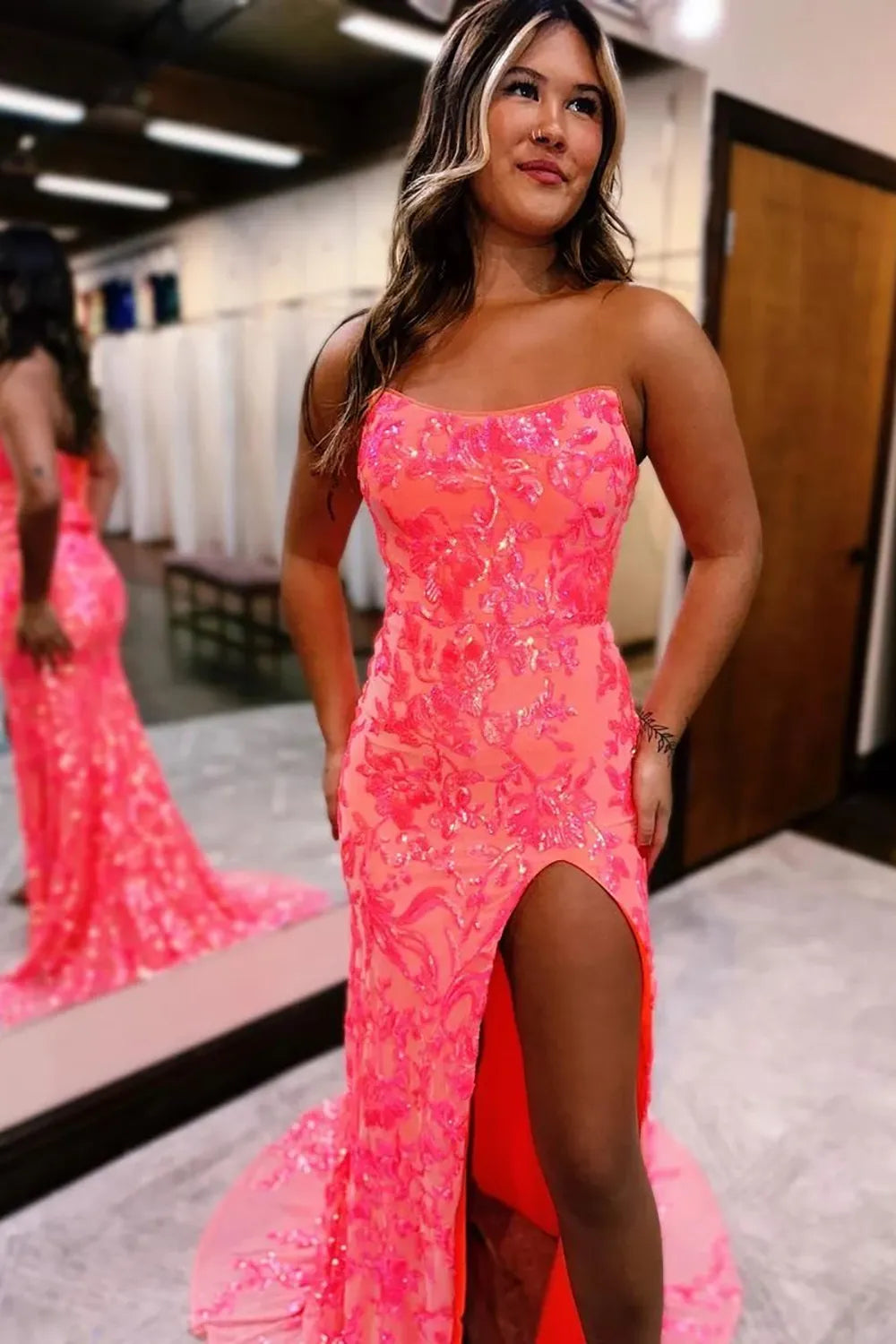 Back view of strapless mermaid prom dress showing lace-up detail.